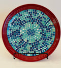 Decorative ceramic plate featuring an Ocean Breeze mosaic design on a deep crimson background, crafted by My Store.