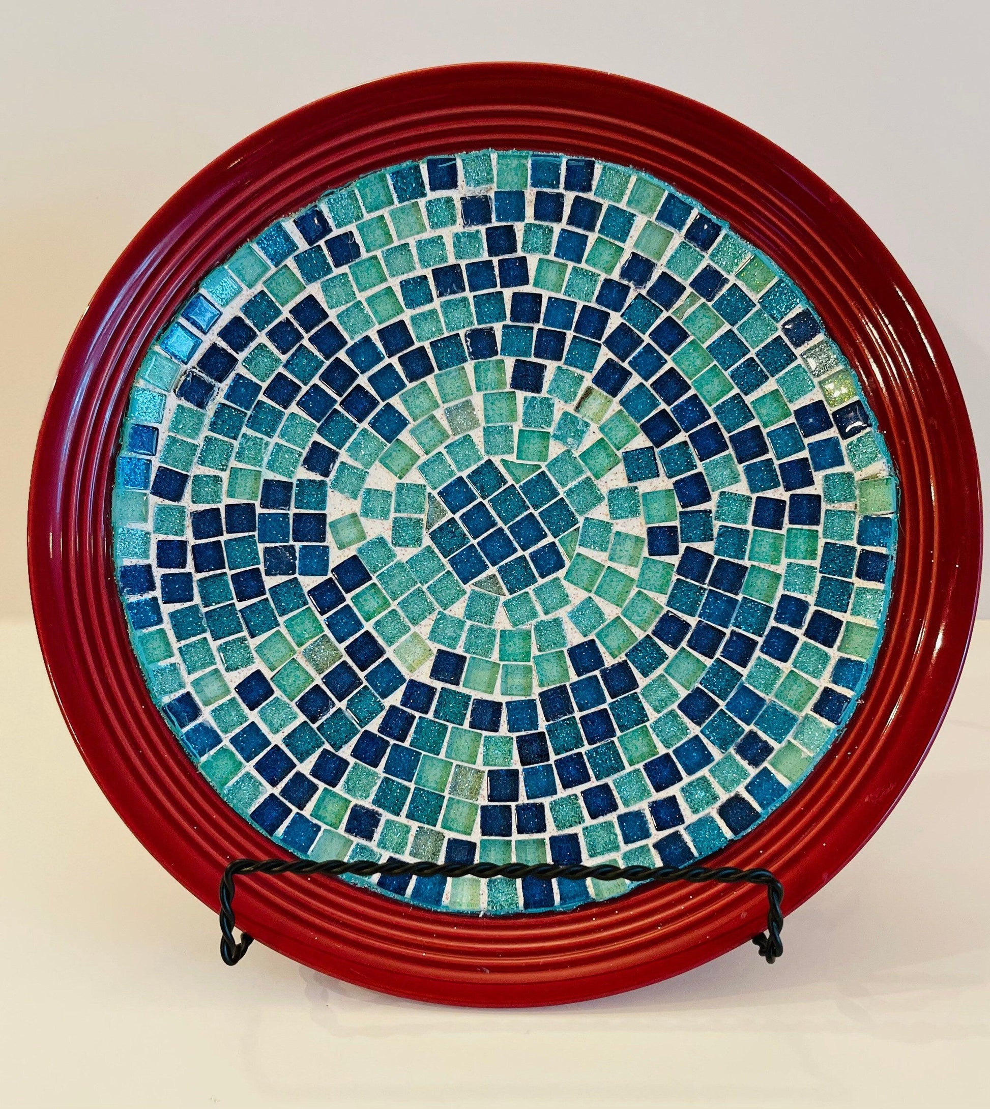 Decorative ceramic plate featuring an Ocean Breeze mosaic design on a deep crimson background, crafted by My Store.