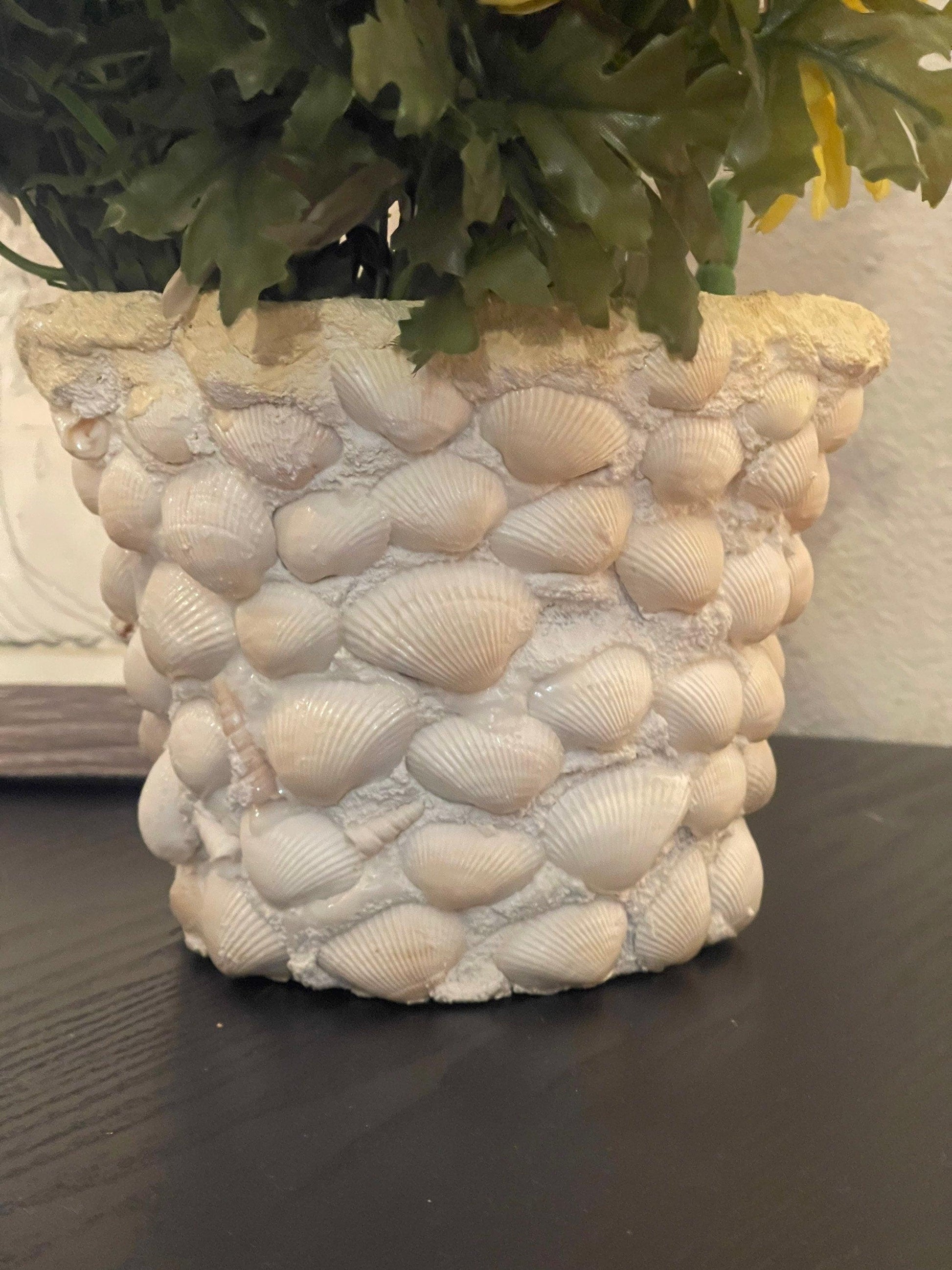 Handcrafted seashell mosaic plant pot with colorful shell inlay, perfect for indoor or outdoor decorative plants.