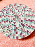 Handcrafted pink and green mosaic plant stand by Miss Bette's Creations, featuring intricate tile patterns and a sturdy design.