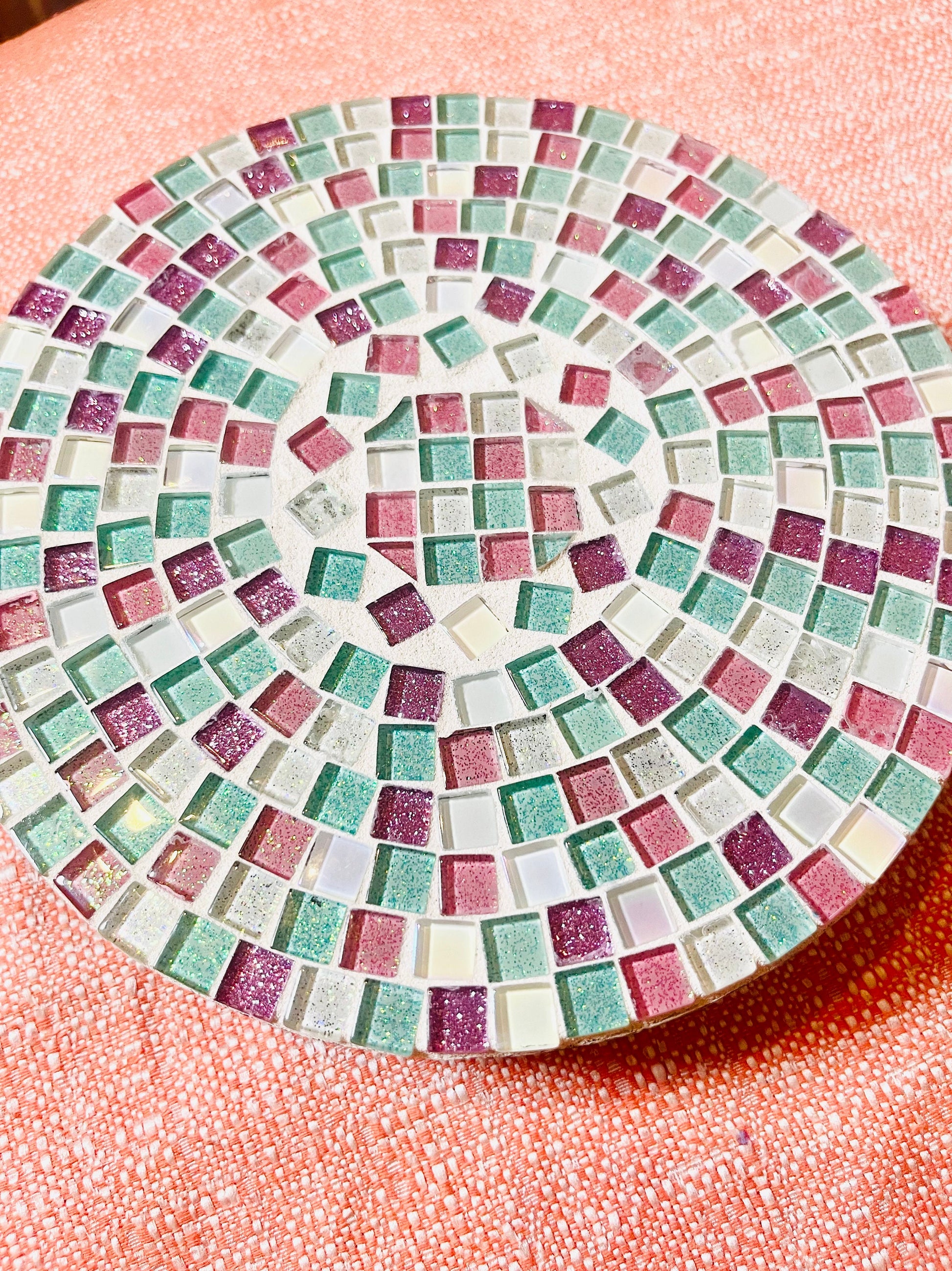 Handcrafted pink and green mosaic plant stand by Miss Bette's Creations, featuring intricate tile patterns and a sturdy design.