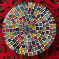 Handmade 7-inch rainbow mosaic plant stand with colorful tiled design for supporting potted plants.