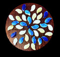 Handcrafted blue and white petal mosaic wooden plant stand with a decorative floral design for indoor or outdoor use.