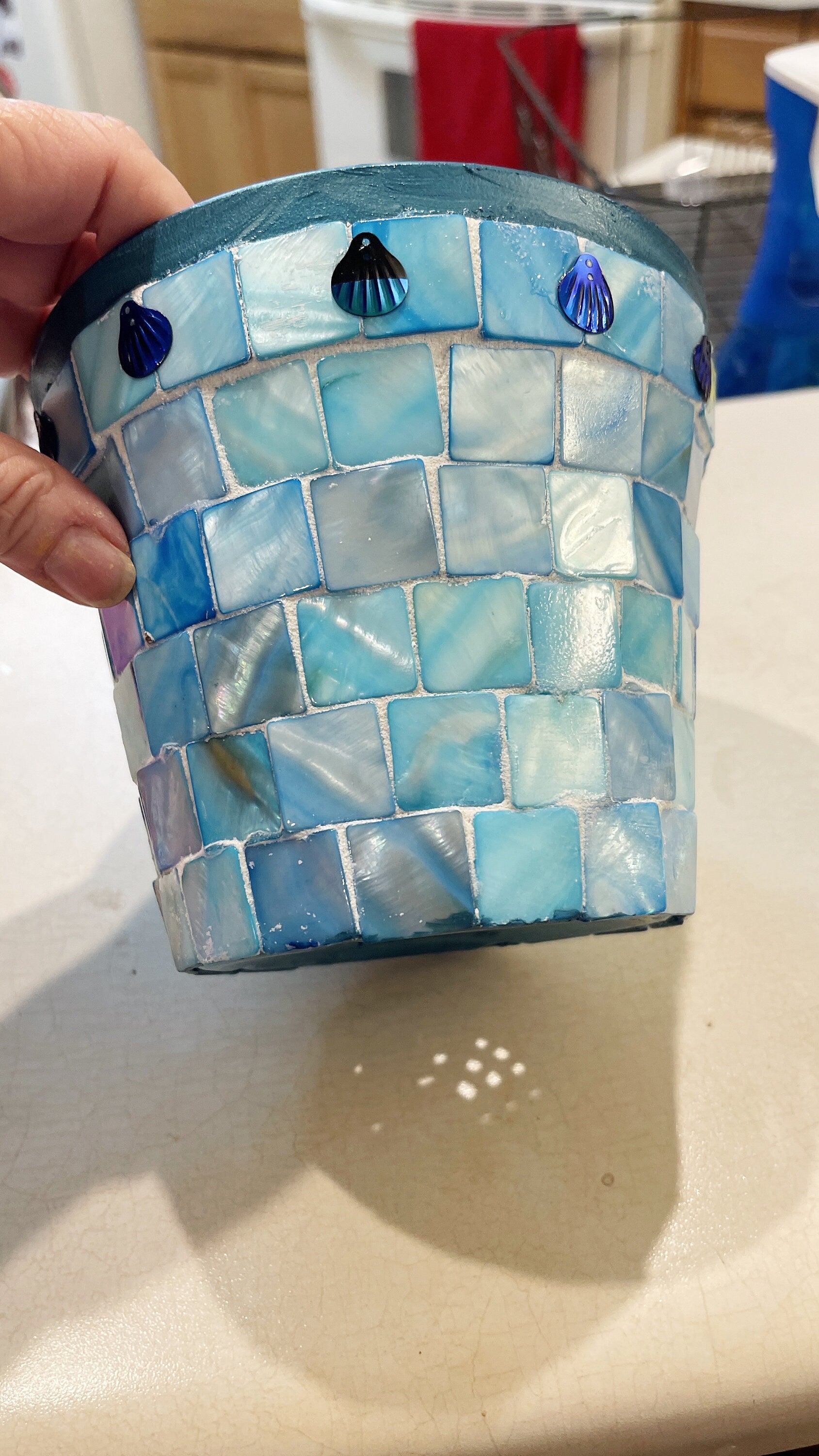 Artisan teal mosaic planter with mother of pearl accents, handcrafted by Miss Bette's Creations, showcasing intricate tile design.
