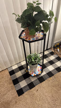Handcrafted 2-tier rainbow mosaic plant stand with colorful tiled shelves for indoor or outdoor use.