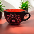 Handpainted extra large coffee mug with colorful floral design, perfect for enjoying large coffee servings.