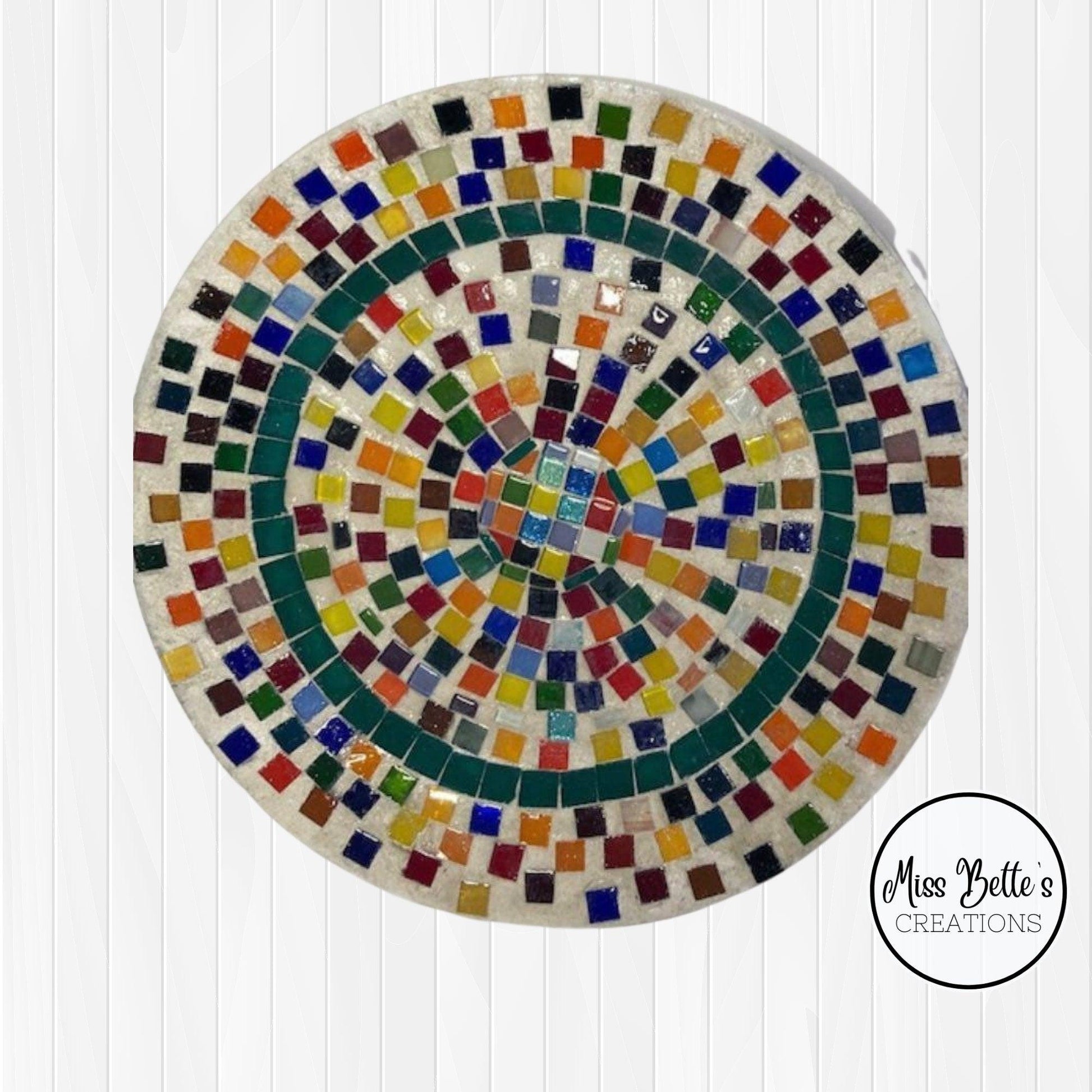 Handcrafted rainbow tile decorative plate with vibrant, colorful patterns, perfect for wall decor or display.