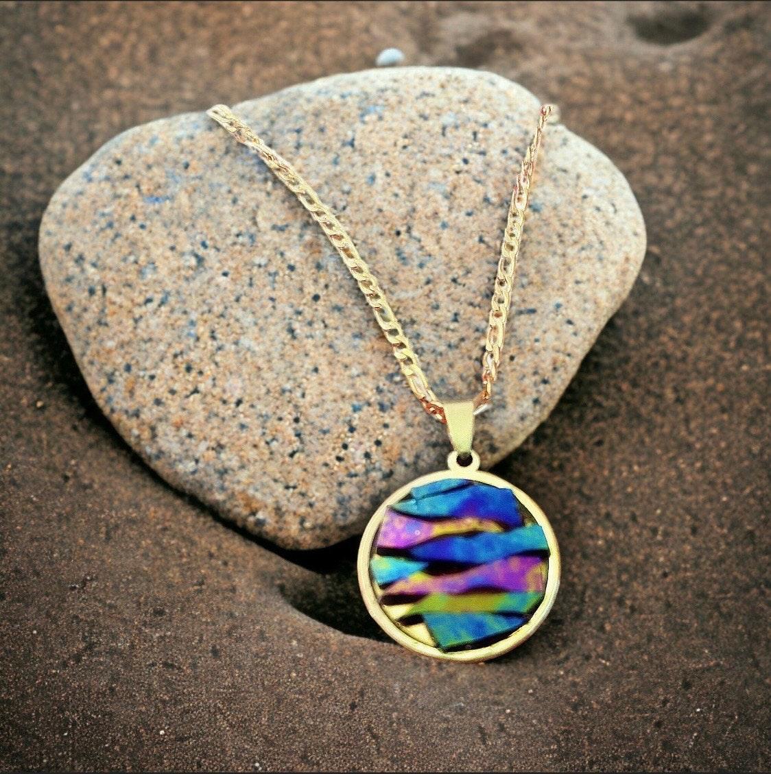 Colorful pendant necklace with vibrant beads and silver chain, stylish jewelry accessory for casual or elegant outfits.