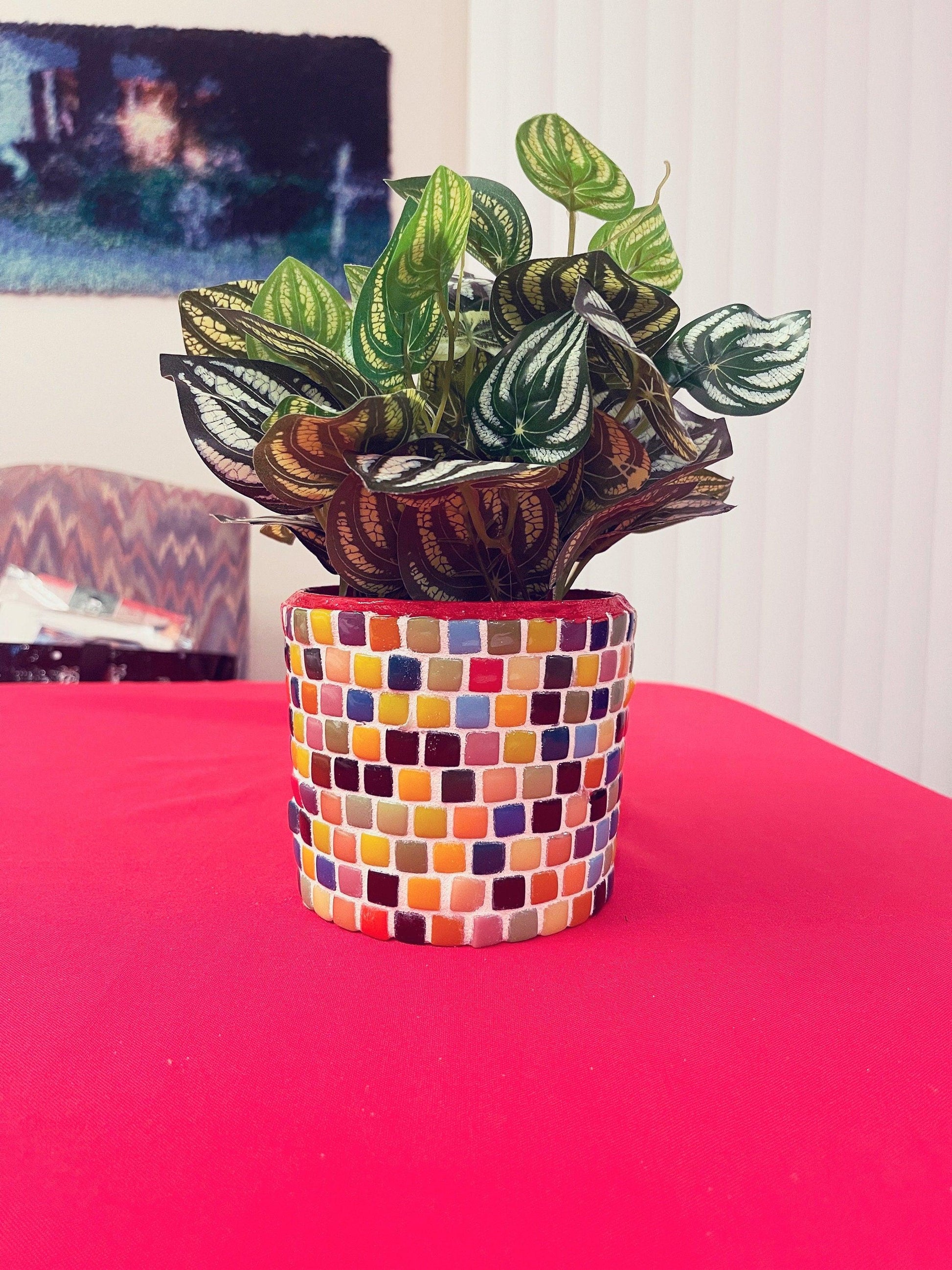 Colorful handmade rainbow mosaic planter with vibrant tile patterns, perfect for indoor or outdoor plant displays.