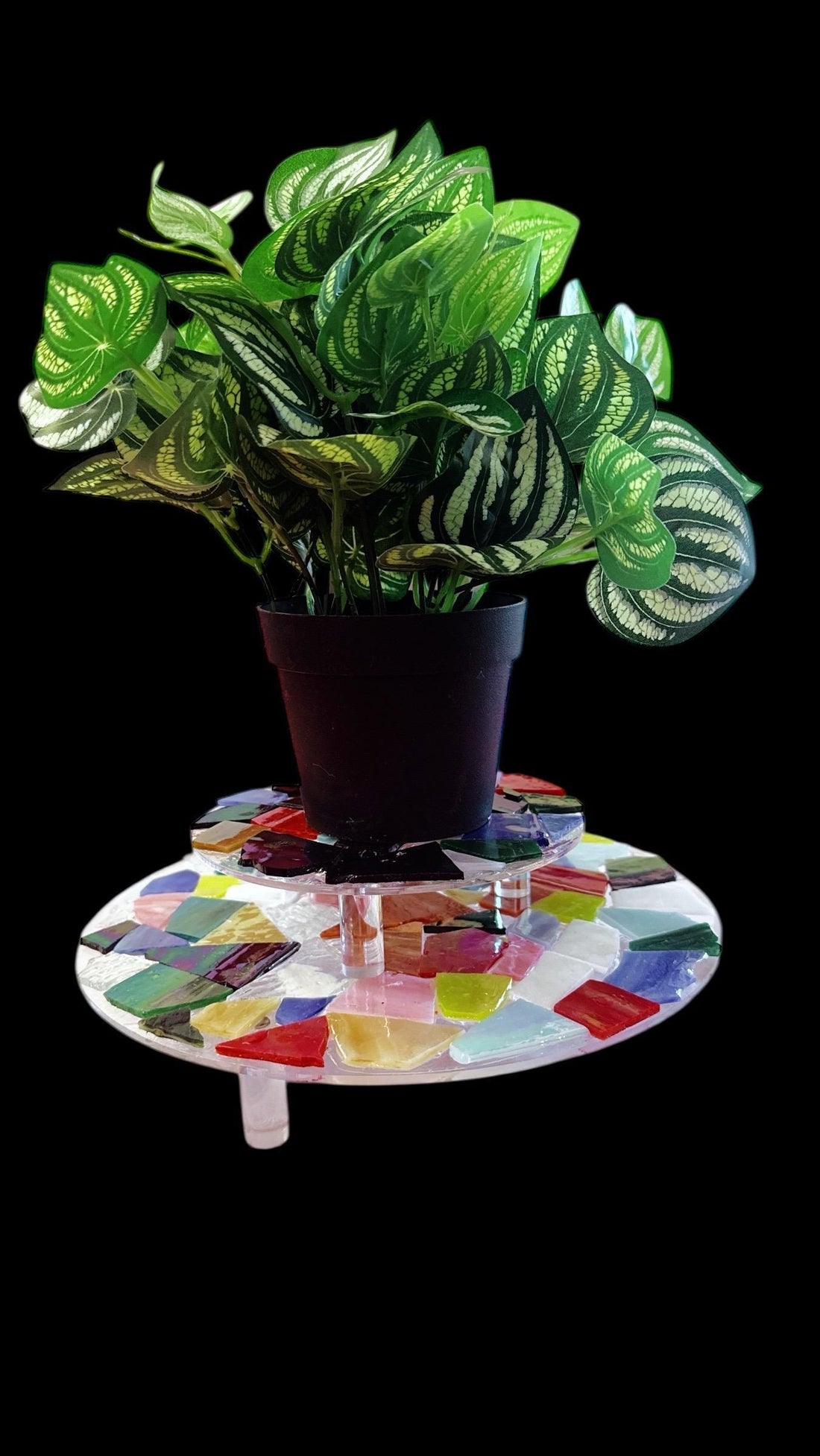 Two-tier multicolored mosaic plant stand with metal frame, showcasing vibrant ceramic tile designs for indoor or outdoor use.