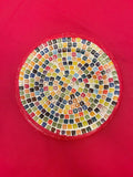 Colorful handcrafted rainbow mosaic decorative plate featuring vibrant glass pieces, ideal for home decor.