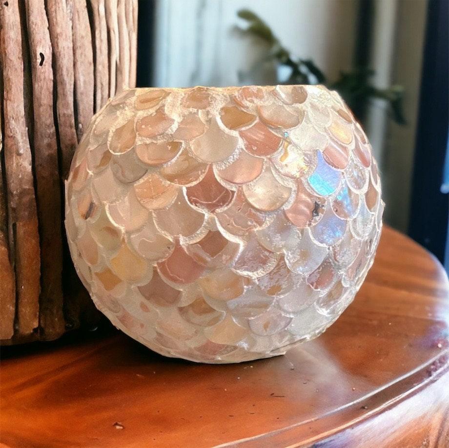 Handcrafted scalloped Capiz shell globe vase with intricate shell details and a rounded shape, ideal for elegant home decor.