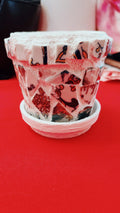 Handcrafted broken china mosaic planter with saucer, featuring colorful mosaic design and sturdy ceramic construction.