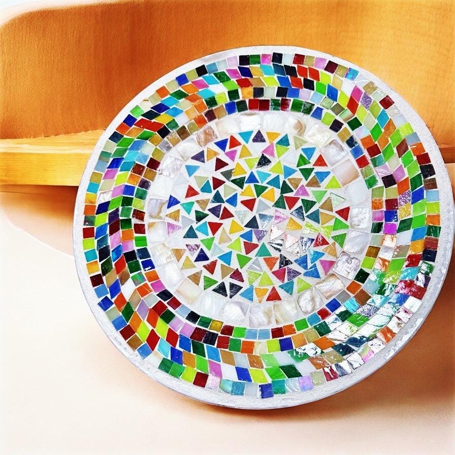 Vibrant handcrafted mosaic fruit bowl with colorful glass tiles, showcasing artistic craftsmanship and decorative appeal.