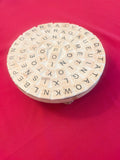 Wooden word game plant stand decor with a playful letter design, perfect for displaying small potted plants indoors.