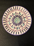 Colorful butterfly decorative hot plate with mosaic design, used as a coaster for protecting surfaces.