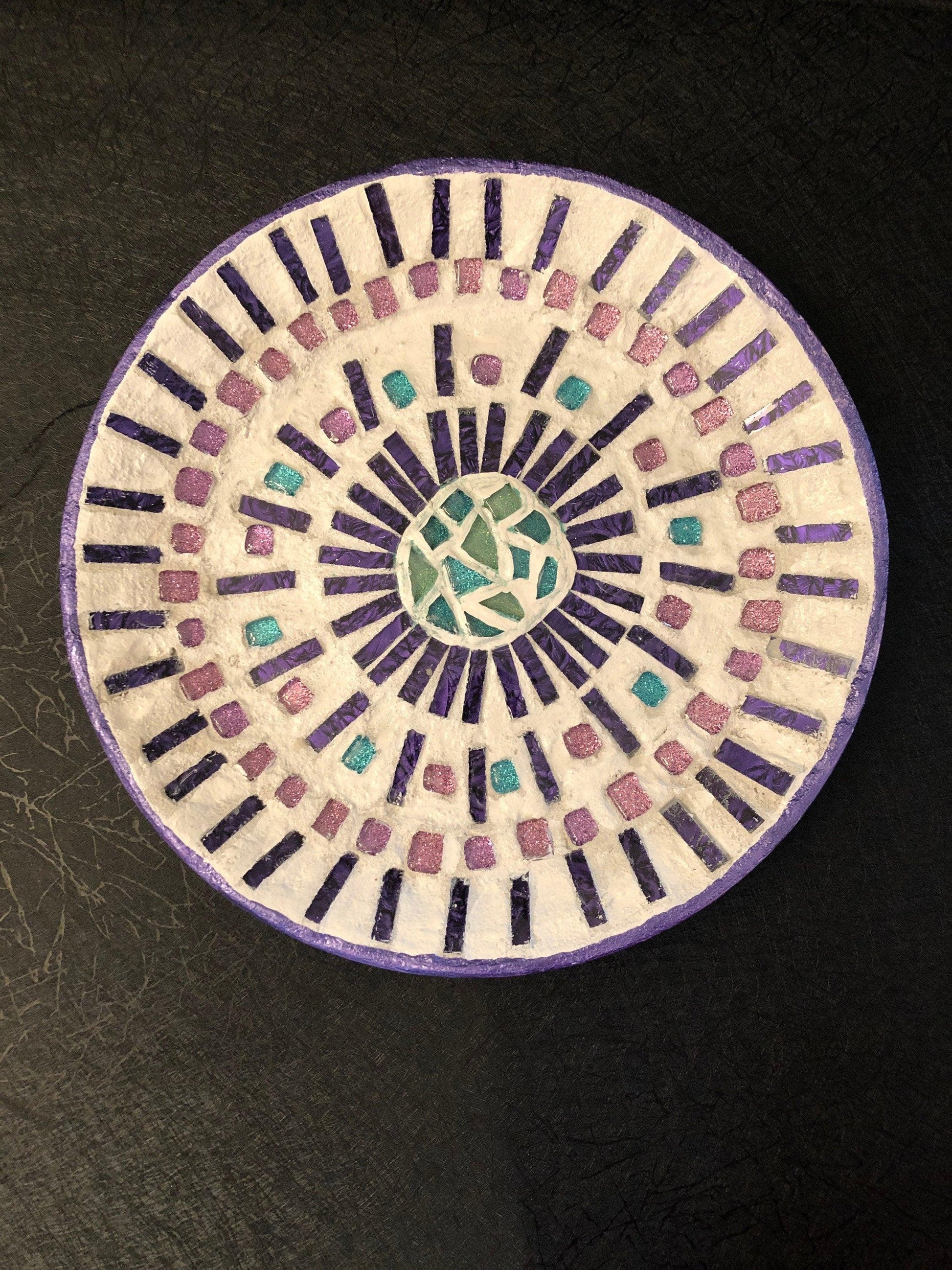 Colorful butterfly decorative hot plate with mosaic design, used as a coaster for protecting surfaces.