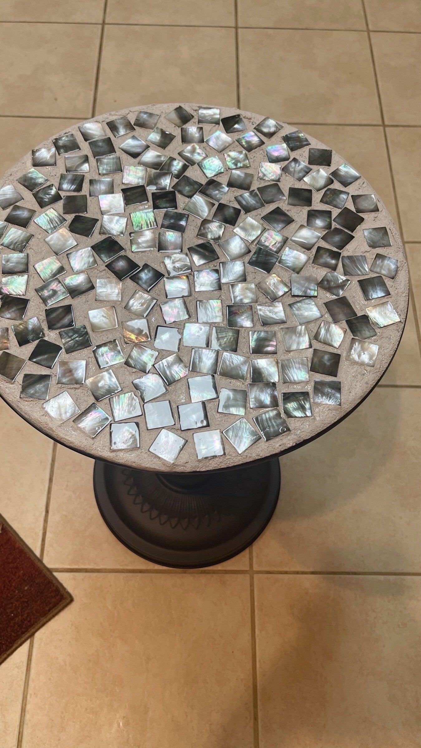 Handmade mosaic round side table with colorful tiled surface and wooden legs, showcasing unique craftsmanship and vibrant design.