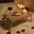 Rustic bamboo bed tray with stone mosaic inlay, ideal for breakfast or serving, showcasing handcrafted natural wood design.