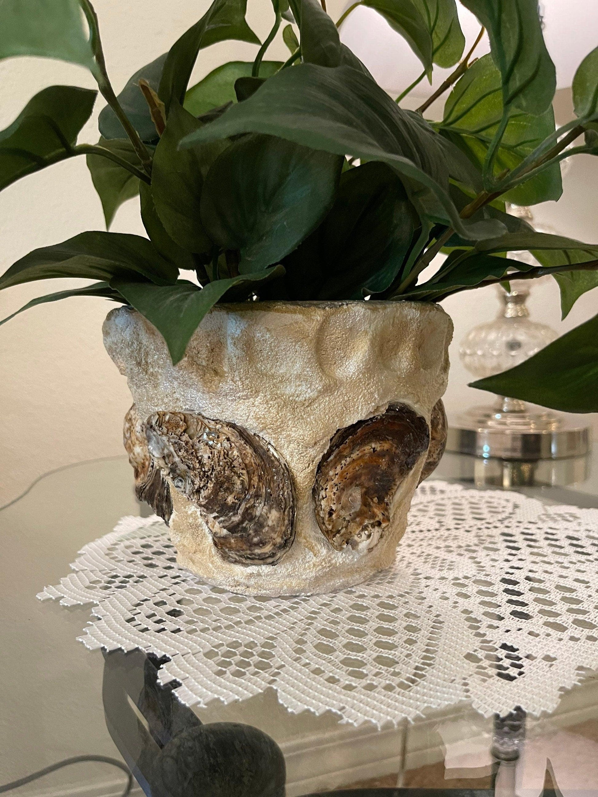 Handcrafted oyster shell relief planter with textured surface and natural coastal design, ideal for outdoor or indoor décor