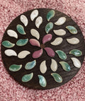 Handcrafted petal mosaic wooden plant stand with colorful floral design, ideal for displaying potted plants indoors or outdoors.