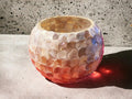 Handcrafted scalloped capiz shell globe vase with intricate design, perfect for elegant home decor.