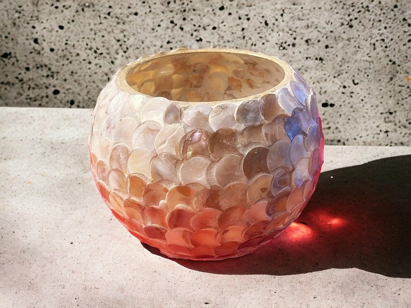 Handcrafted scalloped capiz shell globe vase with intricate design, perfect for elegant home decor.
