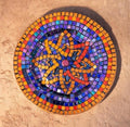 Handcrafted round mosaic wall art featuring colorful ceramic tiles, designed to add artistic elegance to home decor.