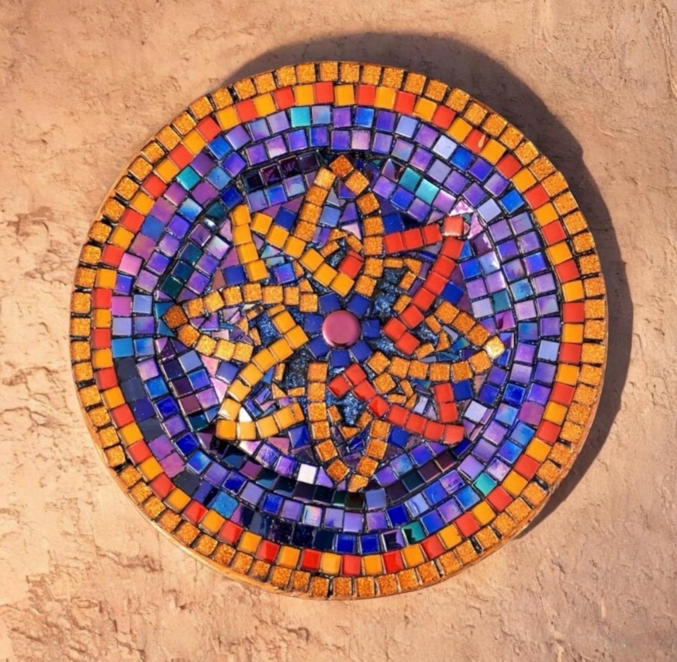 Handcrafted round mosaic wall art featuring colorful ceramic tiles, designed to add artistic elegance to home decor.