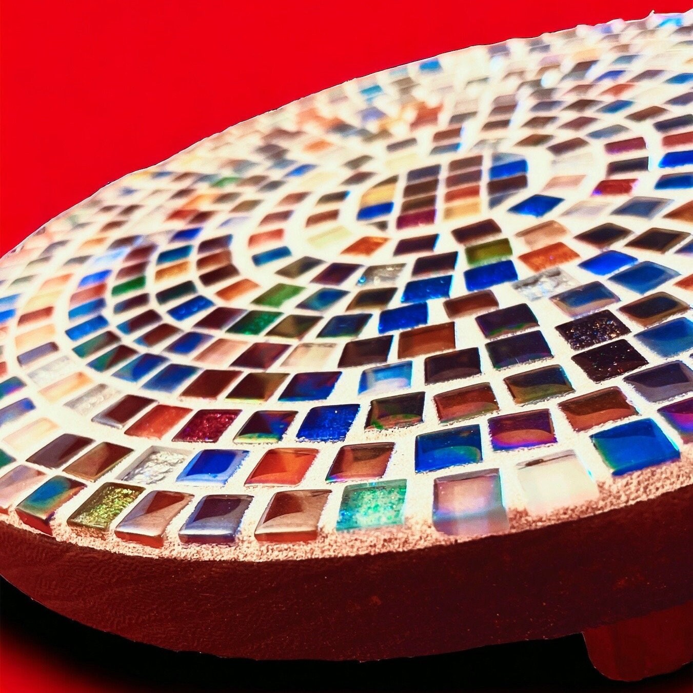 Handcrafted 10-inch rainbow mosaic plant stand by Miss Bette's Creations with colorful tiled design for indoor or outdoor use.