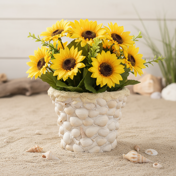 Handcrafted seashell mosaic plant pot with colorful shell patterns, perfect for indoor or outdoor garden decor.