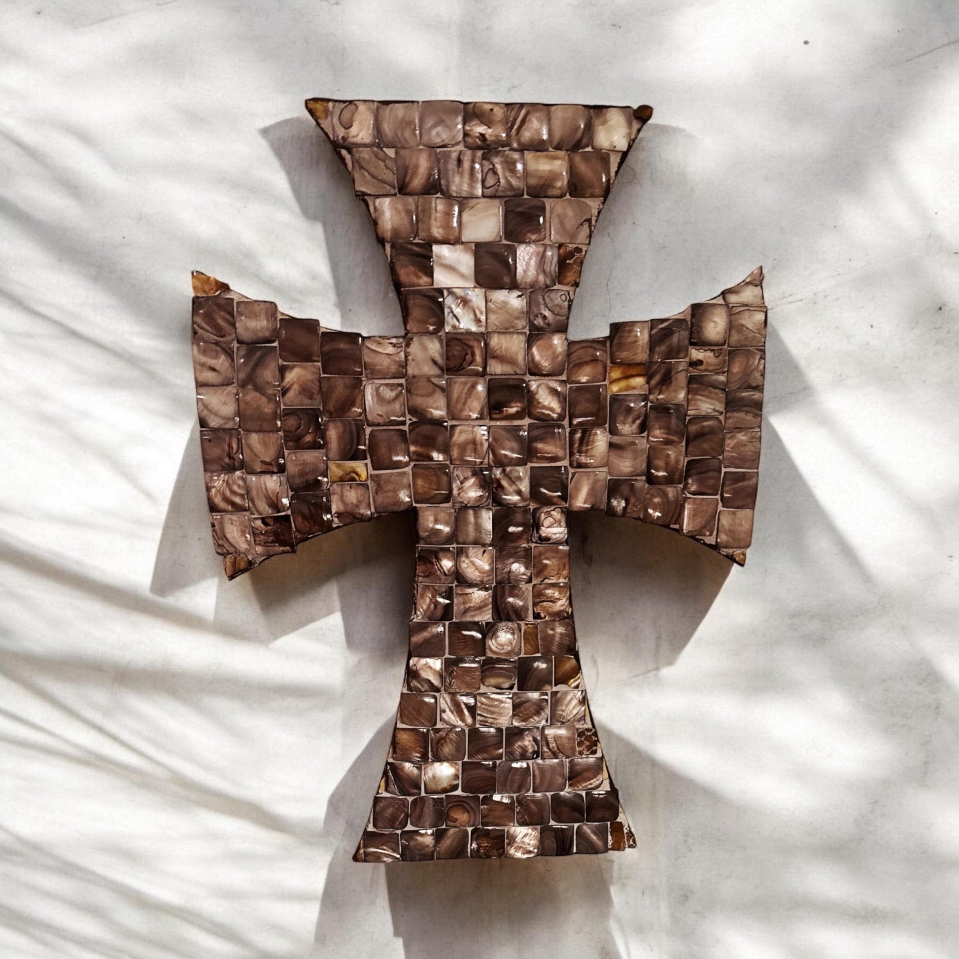 Mother of Pearl mosaic cross with intricate inlay design, crafted from shimmering pearl tiles, ideal for wall decor.