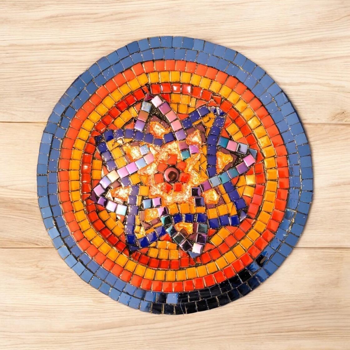 Decorative mid-century modern mosaic plate with colorful geometric patterns, showcasing intricate ceramic craftsmanship.