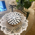 Handmade black and white checkered mosaic plant stand with a sturdy base perfect for indoor or outdoor plants.