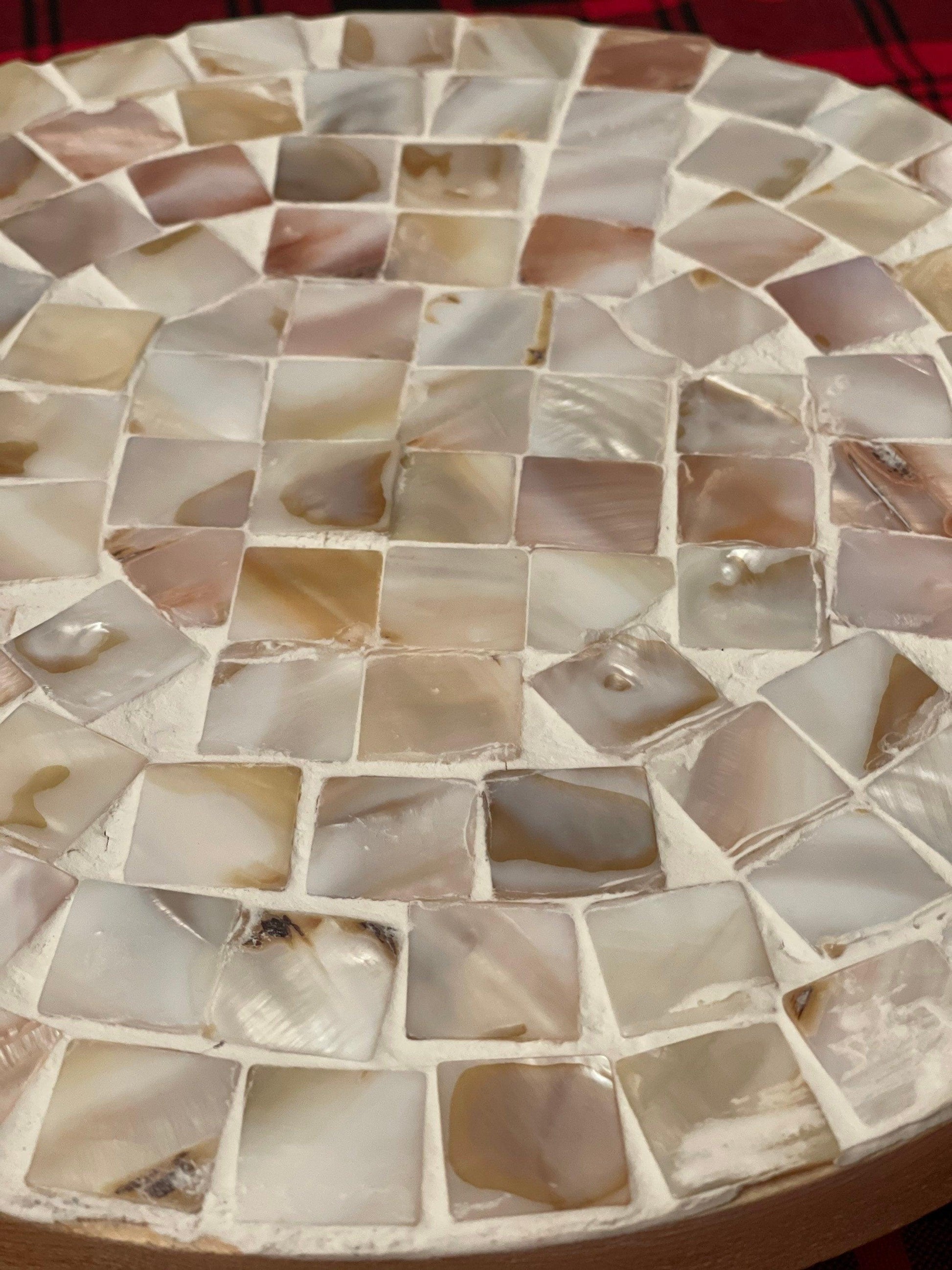 Handmade mother of pearl mosaic plant stand with intricate design, perfect for displaying indoor or outdoor plants.