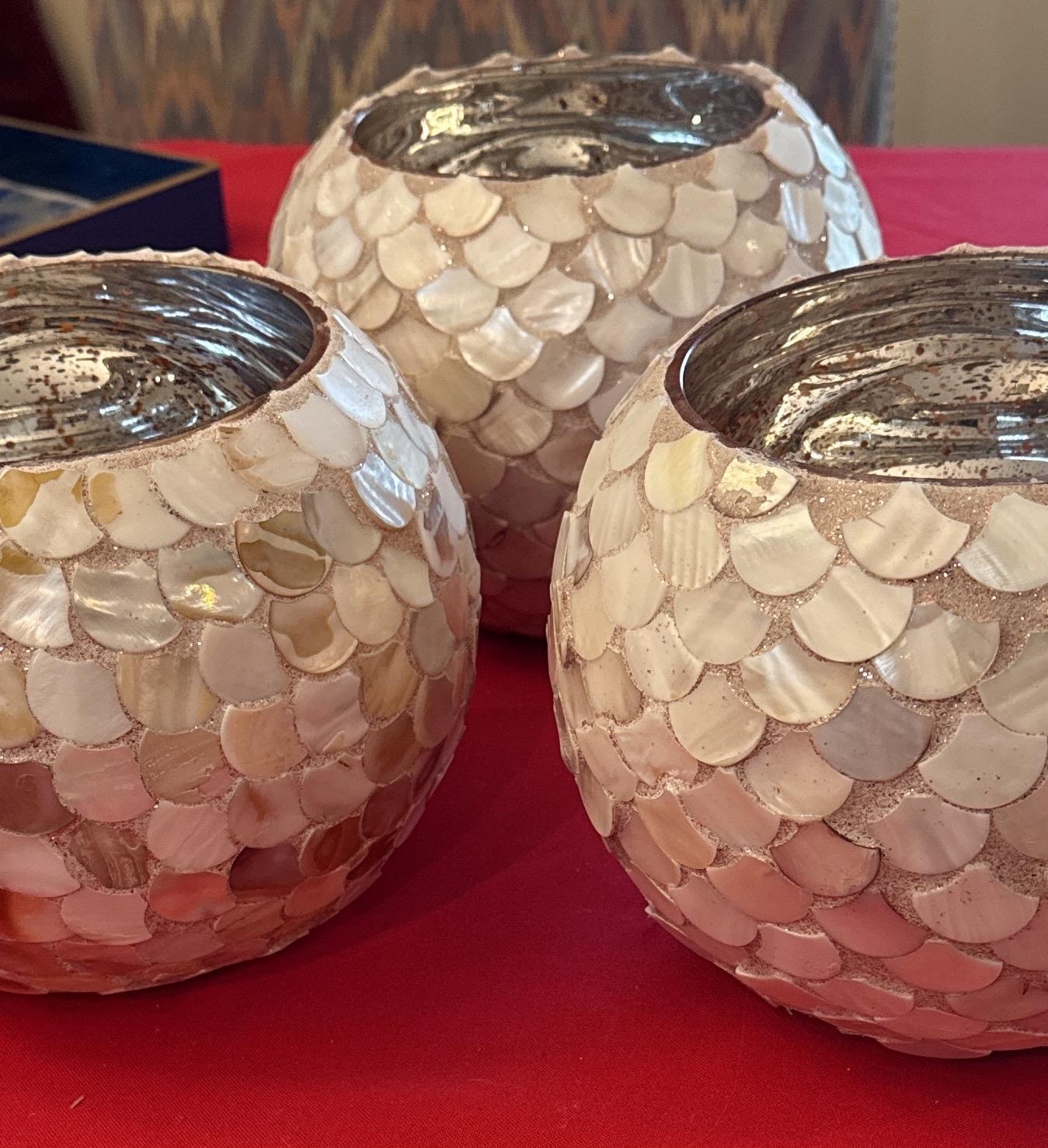 Handcrafted scalloped Capiz shell globe vase with a delicate, translucent design, perfect for elegant home decor.