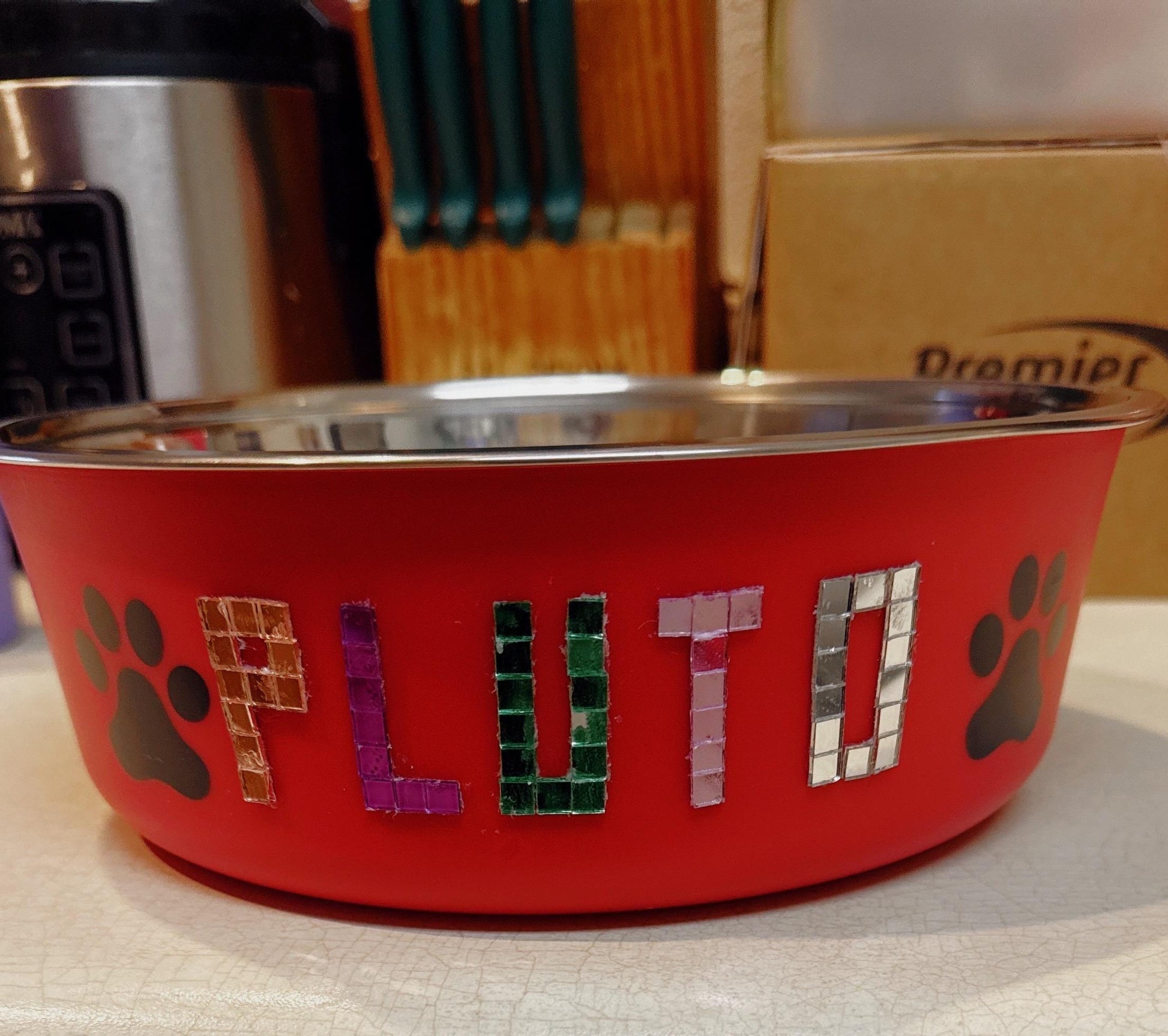 Custom dog and cat feeding bowl with personalized design, ceramic material, and colorful pattern for pets.