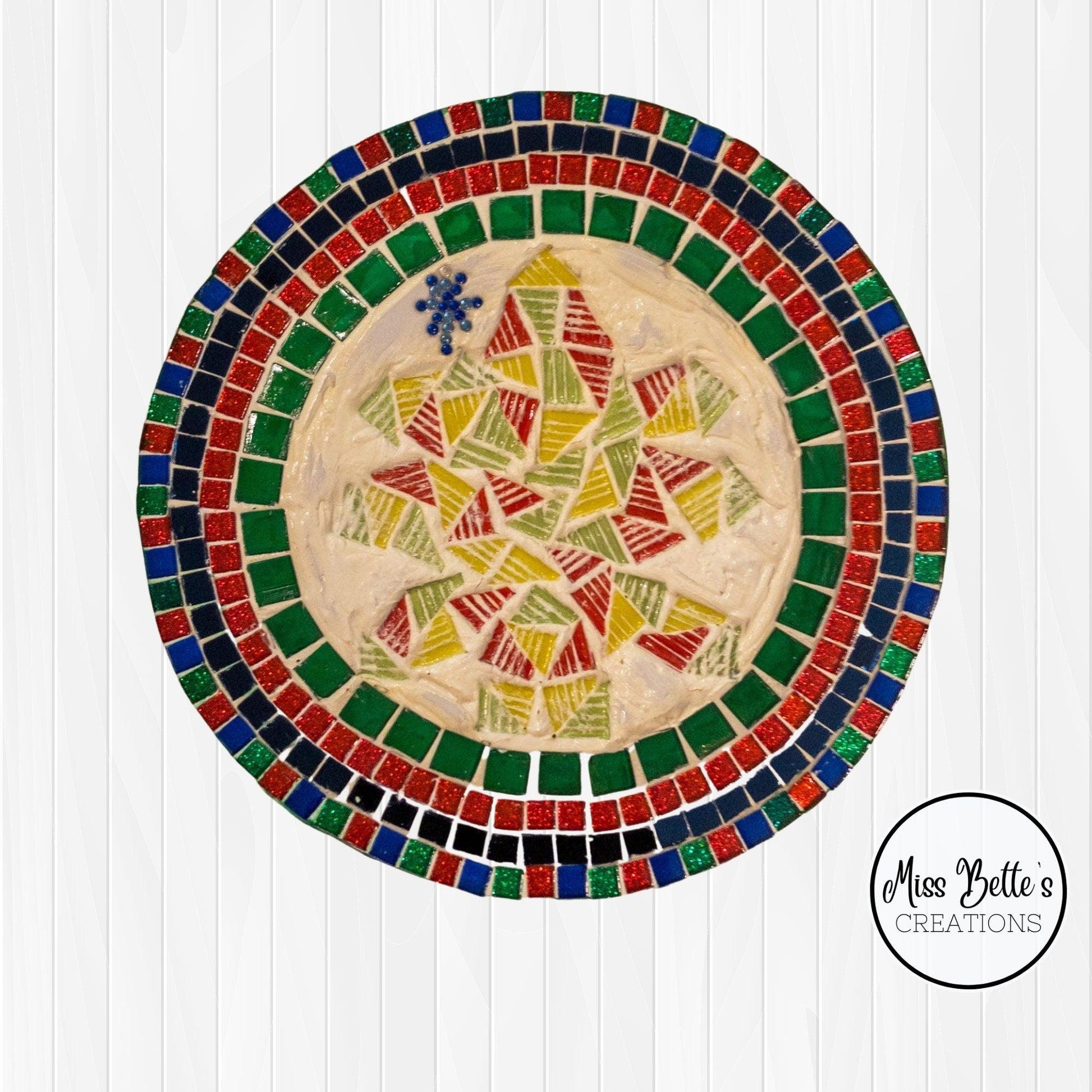 Artisan handcrafted round mosaic decorative plate with colorful tile patterns, perfect for wall decor or display.