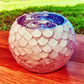 Handcrafted scalloped capiz shell globe vase with a delicate, shimmering design, perfect for elegant home decor.