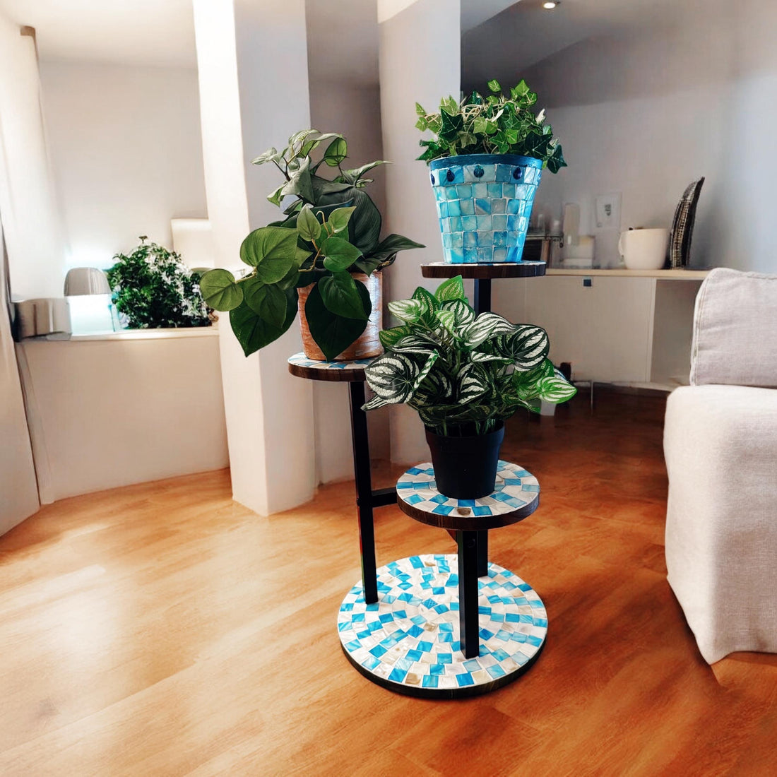 Three-tier Azure mosaic plant stand with decorative blue tiles and metal frame, perfect for displaying indoor plants.
