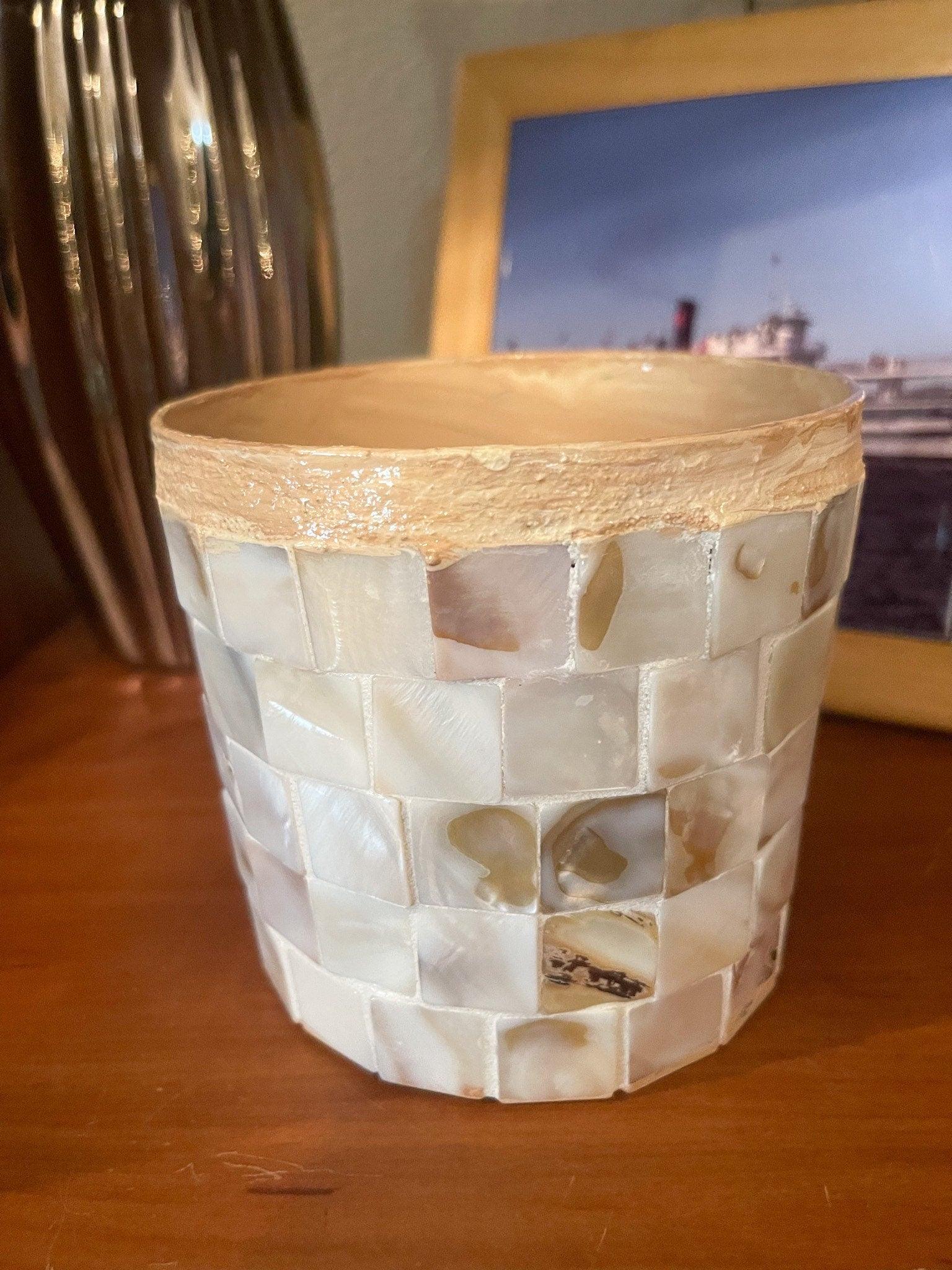 Handcrafted mother of pearl mosaic flower pot with intricate floral design, showcasing shiny pearl tiles and artistic craftsmanship.