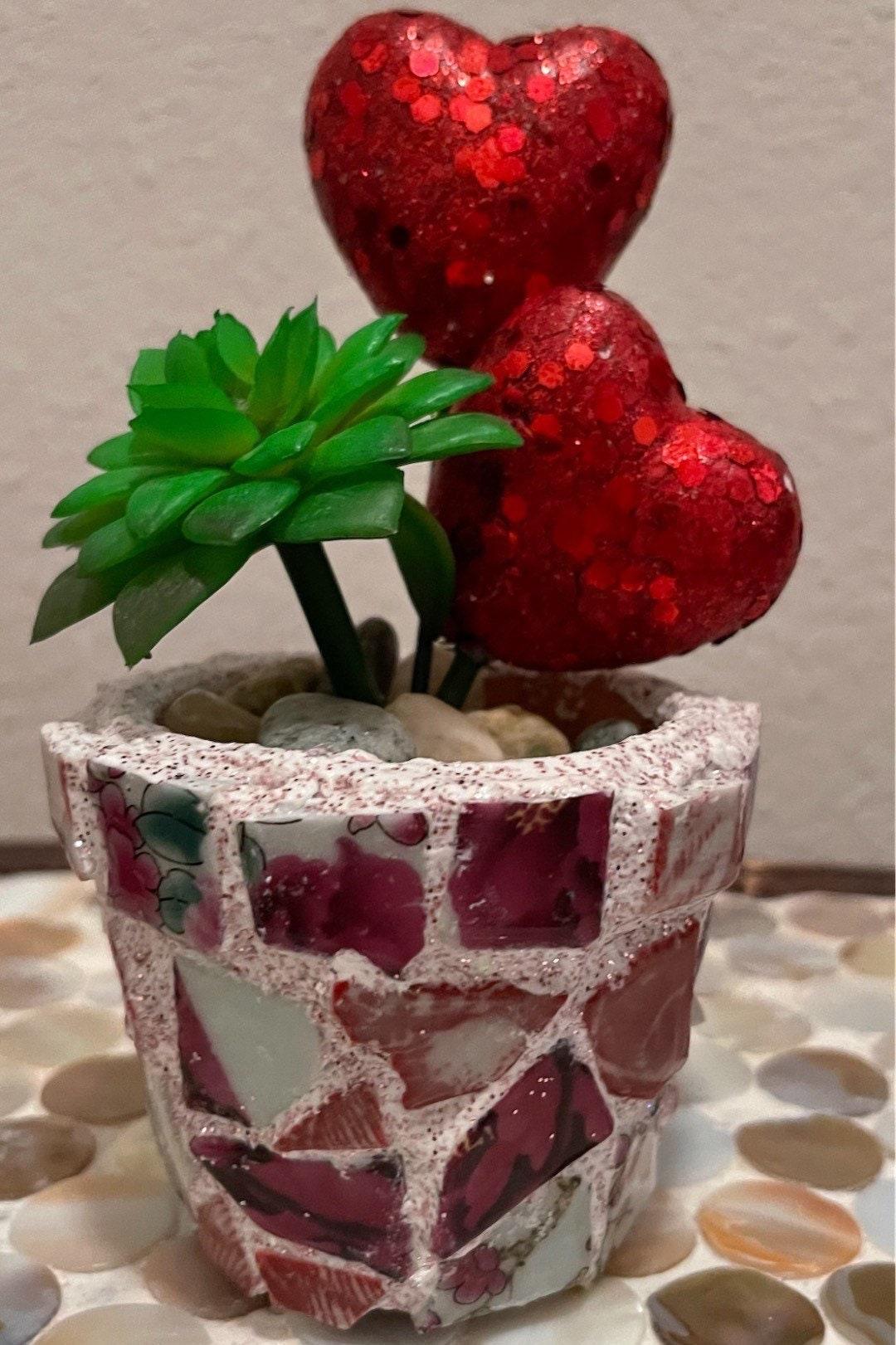 Handcrafted broken china heart mosaic planter with colorful mosaic design, perfect for indoor or outdoor decorative planting.