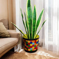 Colorful flower bouquet in a rainbow mosaic hexagon planter, showcasing vibrant blooms and decorative ceramic design.