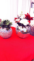 Reflective mirror ball disco globe vase with a spherical shape and mirrored surface, ideal for decorative floral arrangements.