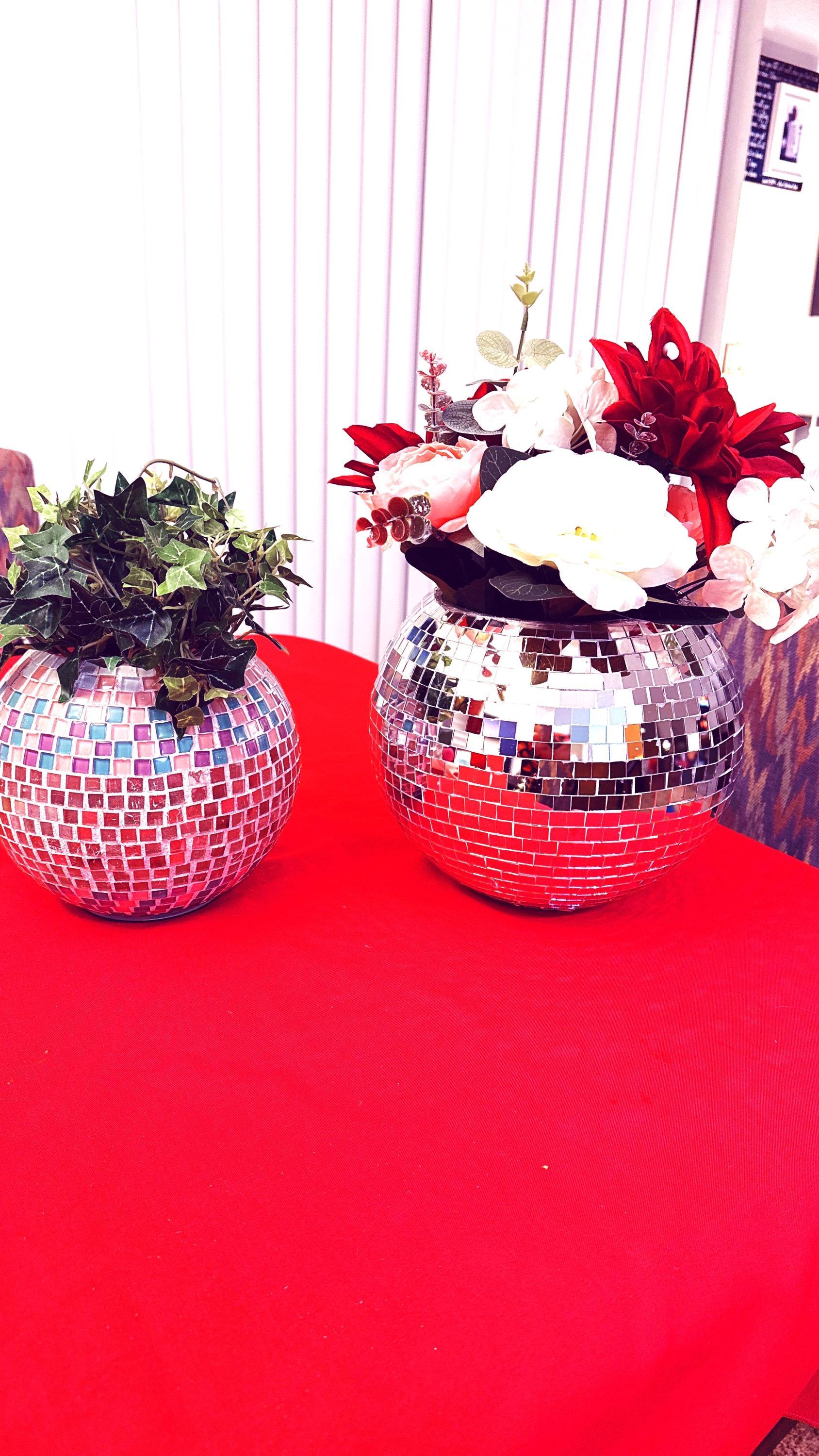Reflective mirror ball disco globe vase with a spherical shape and mirrored surface, ideal for decorative floral arrangements.
