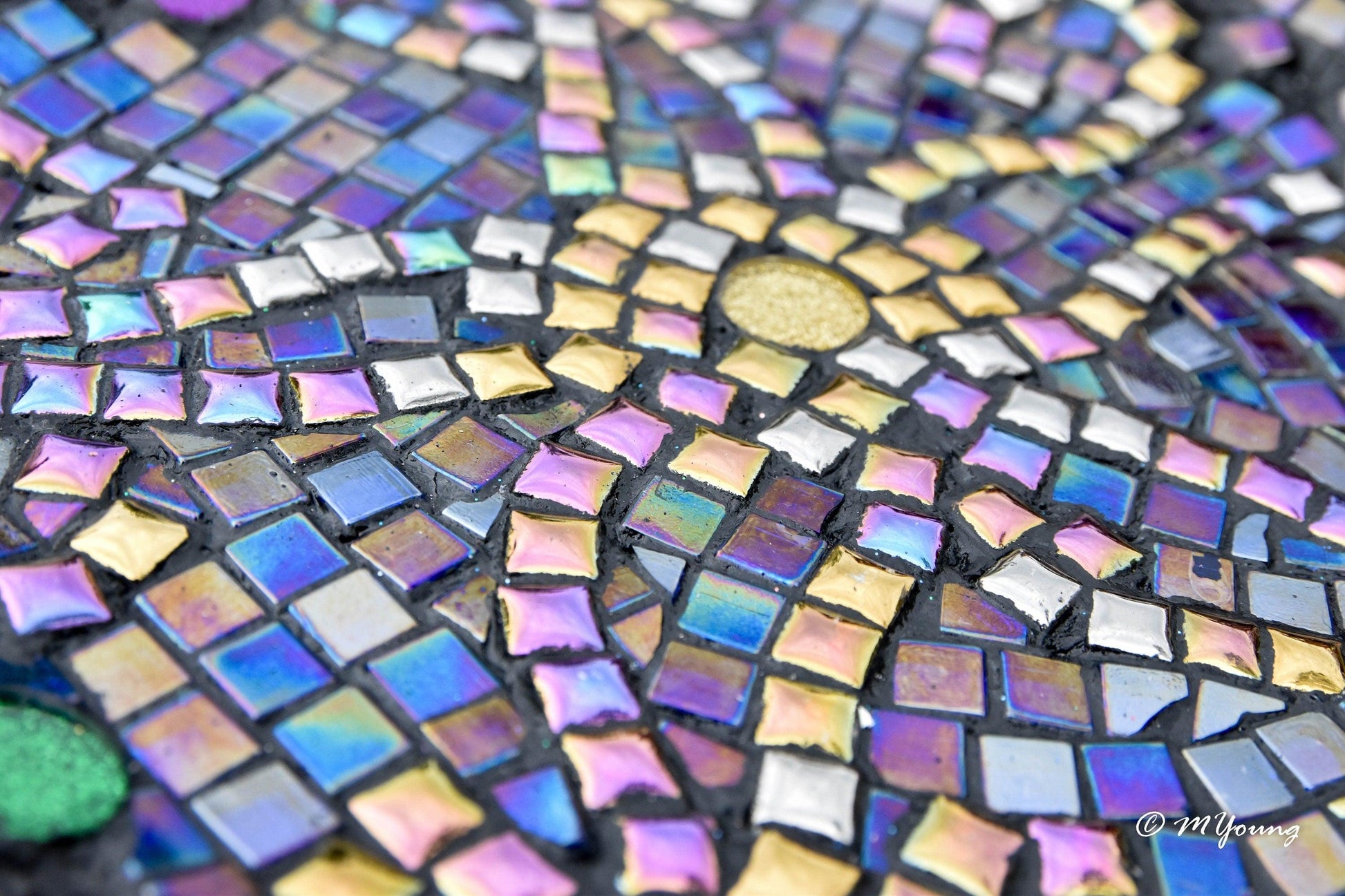 Colorful iridescent mosaic wall art with handcrafted design, featuring vibrant glass tiles for decorative wall decor.
