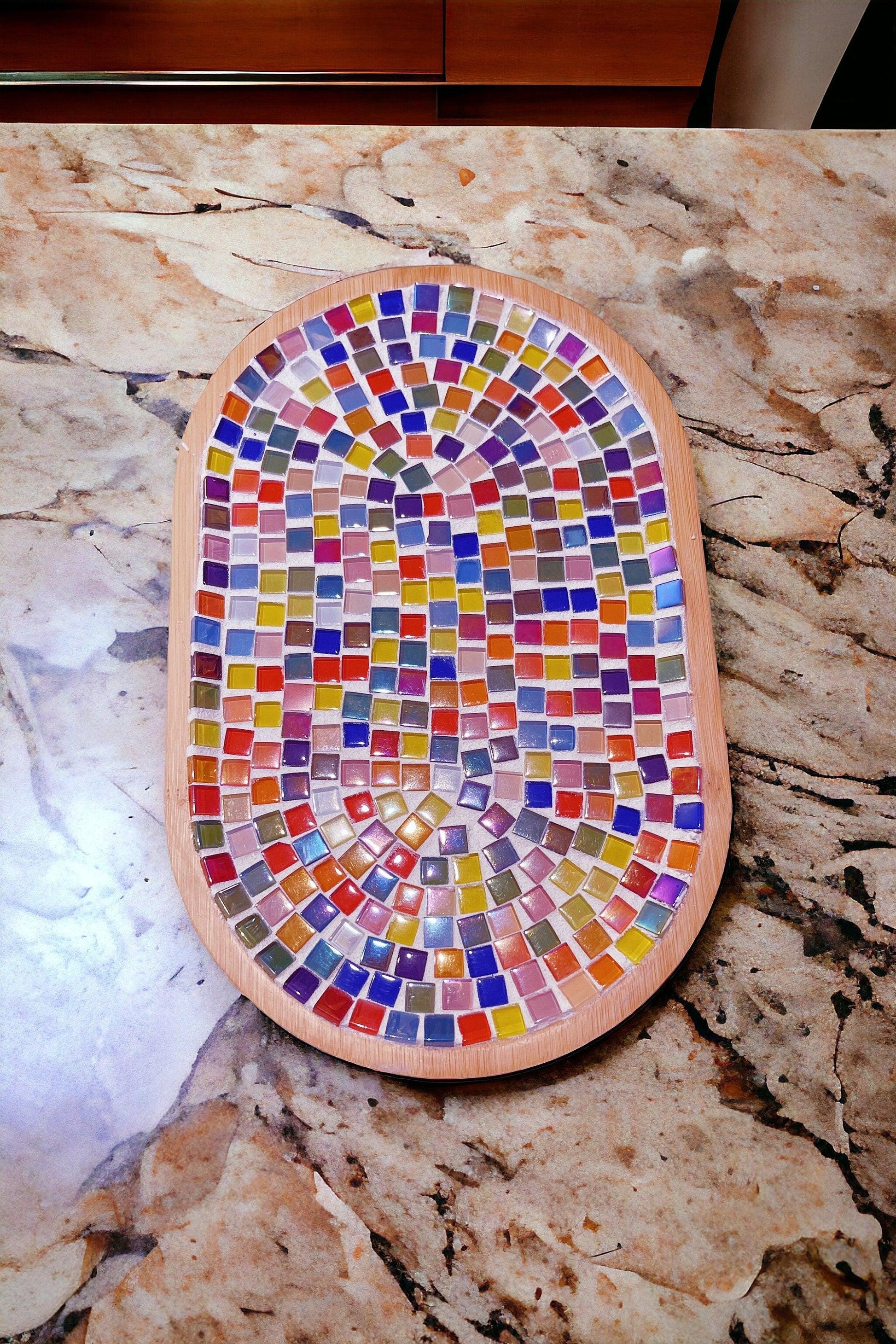 Handcrafted geometric star mosaic wall art featuring colorful tile patterns, ideal for modern home decor.