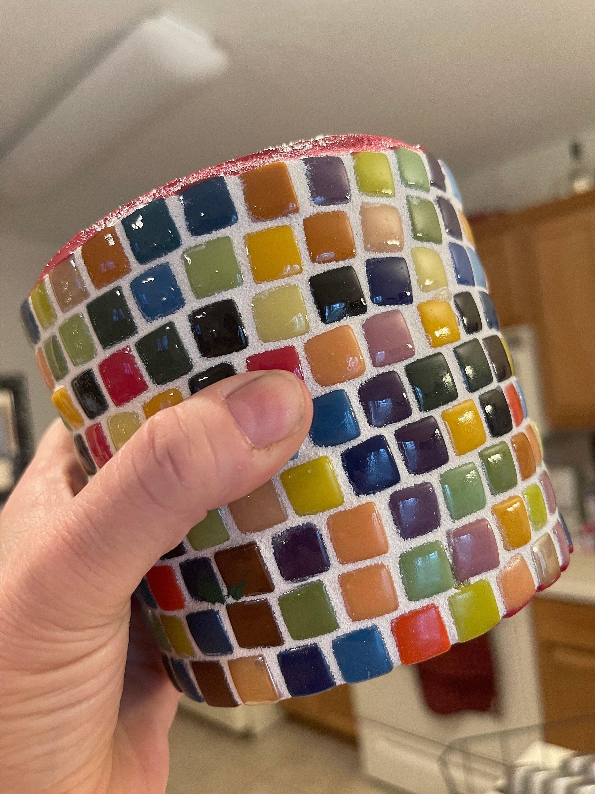 Colorful handcrafted rainbow mosaic planter with intricate tile design, perfect for indoor or outdoor plants.