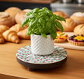 Handcrafted pink and green mosaic plant stand by Miss Bette's Creations, featuring intricate tile patterns and sturdy design.