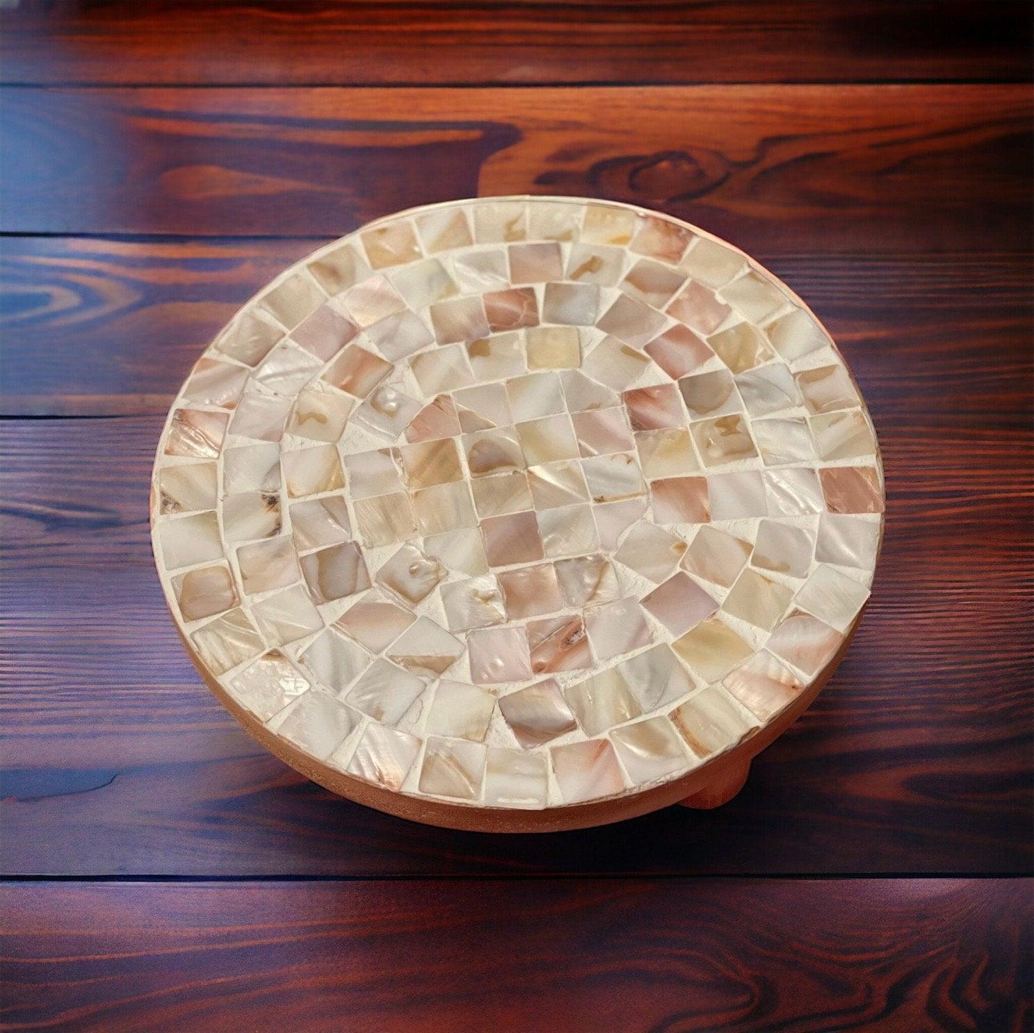 Handmade mother of pearl mosaic plant stand with intricate design, suitable for displaying potted plants in home decor.